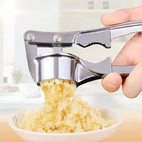 Robust garlic press made of stainless steel